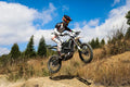 2025 Surron Ultra Bee HP – rider jumping on off-road trail
